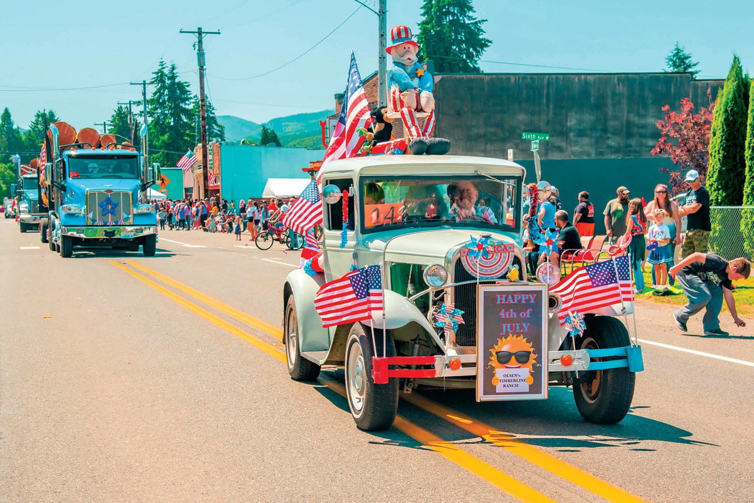 Vehicles decorated for Fourth of July celebrations make their way down North Main Street in downtown Pe Ell during a parade in 2021.